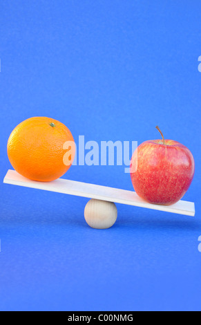 Apples and oranges comparison concept Stock Photo