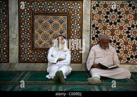 People praying at king Hussein mosque in downtown Amman, Jordan. Stock Photo