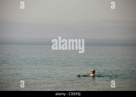 People floating on the dead sea, Jordan. Stock Photo