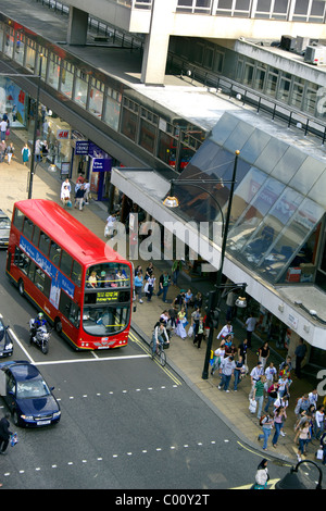 Oxford Street, London, England, UK, Oxford St, red London bus, people, shoppers, crowds, traffic, cyclist, motorbike, bike, Stock Photo