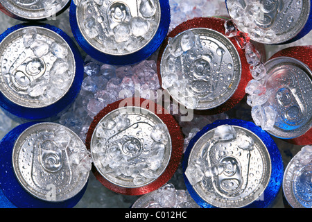 Photo of cans of drink on crushed ice. Stock Photo