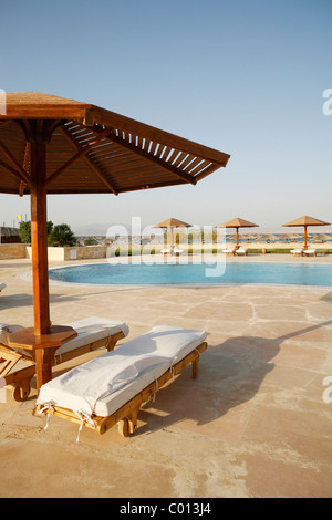 Sun lounges and sunshades around a swimming pool, Soma Bay, Red Sea, Egypt, Africa Stock Photo