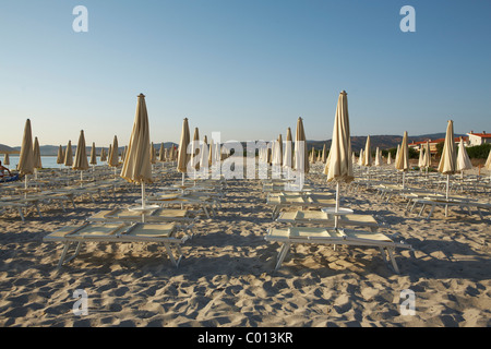 Parasols and deck chairs on a beach in the morning, Sardinia, Italy, Europe Stock Photo