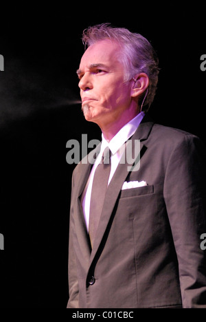 Billy Bob Thornton smoking on stage as he performs with the Boxmasters