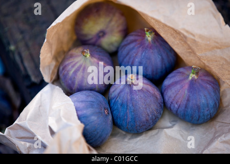 Six ripe figs in a brown paper bag Stock Photo