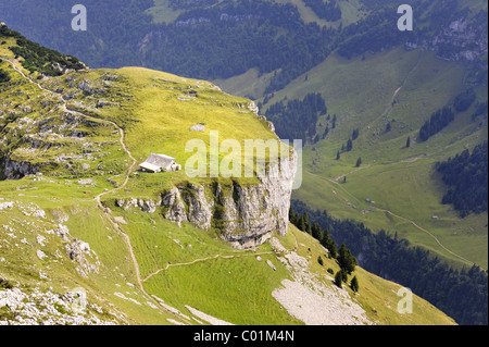 The exposed Alp Chlus on Zisler Mountain with a trail to Ebenalp Mountain, Wildkirchli, Schaefler Stock Photo