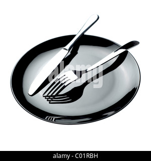 Empty black plate with knife and fork on white background Stock Photo