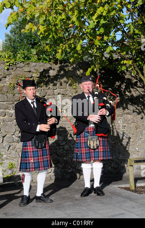 Irish men wearing kilts and playing bagpipes at the Fleadh Cheoil 2009, the largest festival of traditional music in Tullamore Stock Photo