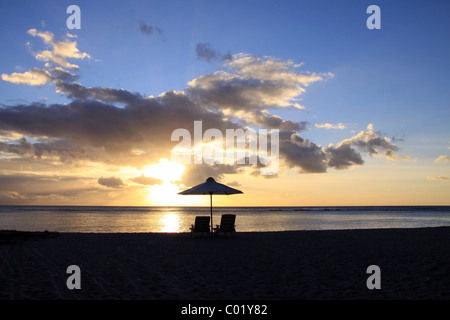 Sunset on the public beach of Flic en Flac on the western coast of Mauritius, Africa Stock Photo