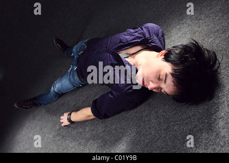 The young man on a floor. Stock Photo