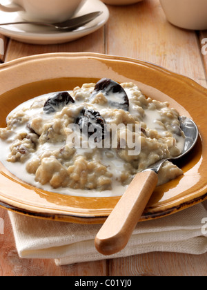 Individual portion of porridge and fruit vegetarian breakfast Stock Photo
