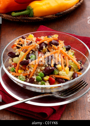 Individual portion of quinoa salad with peas sweetcorn carrots red peppers red kidney beans vegetarian meal Stock Photo