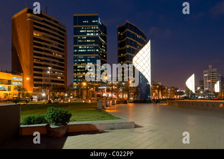 The seaside Larcomar Shopping Center and apartments illuminated at night in Miraflores, Lima, Peru, South America. Stock Photo