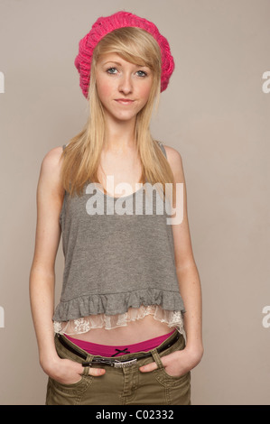 A slim blonde 14 year old teenage girl, with braces on her teeth UK