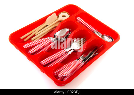 red checked cutlery and wooden spoons in pastic tray Stock Photo