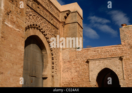 Red ochre stone arch of ancient Yacouh el Mansour Bab Oudaia entrance gate to Kasbah in Rabat Morocco Stock Photo