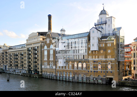 Butlers Wharf an English historic building converted into apartments from dockside warehouses beside River Thames Shad Thames Southwark London England Stock Photo