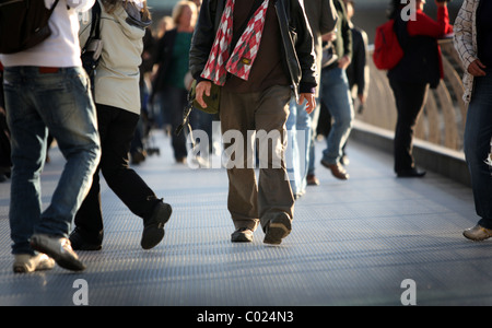 Pedestrians feet on the Millennium Bridge, London Stock Photo