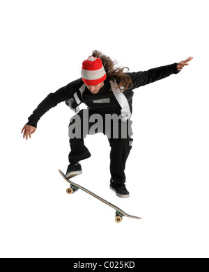 Young skateboarder jumping performing a trick isolated over white background Stock Photo