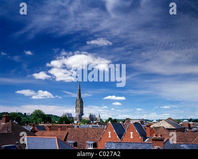 Salisbury cathedral viewed across city rooftops, Salisbury, Wiltshire, England. Stock Photo