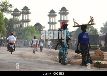 People walk along a road in Makeni, Sierra Leone, on Tuesday February 24, 2009. Stock Photo