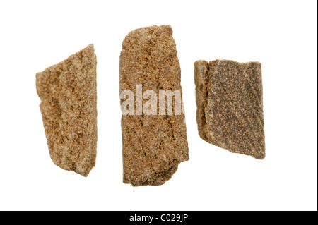 pieces of hashish, photo taken with a macro lens, isolated on a white background Stock Photo