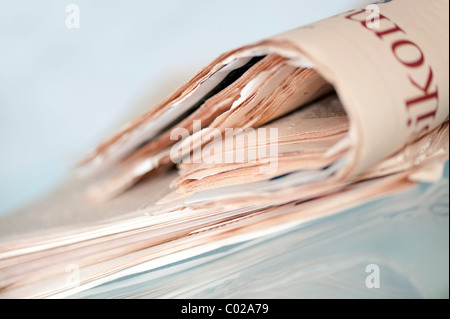 Pile of old yellowed newspapers Stock Photo