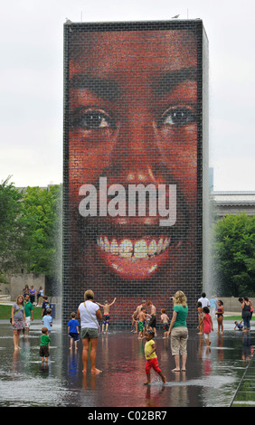 Children having fun with the water fountains of Crown Fountain, Millennium Park, Chicago, Illinois, United States of America Stock Photo