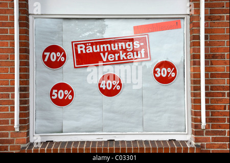 Clearance sale sign in a shop window Stock Photo