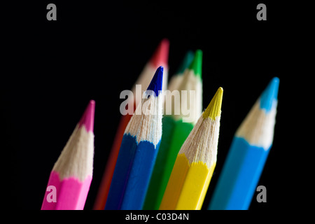 Color pencils on black background. Selective focus. Stock Photo