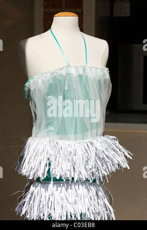 Fancy dress with a tiered skirt made of shredded paper in a shop window, clothing created by fashion students, Middelburg Stock Photo