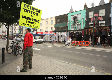 placard holder in Camden high street Stock Photo