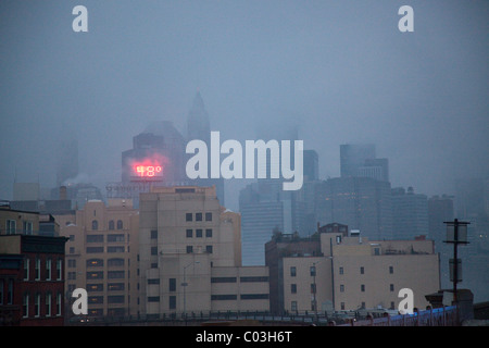 Manhattan and Brooklyn skyline in fog Stock Photo