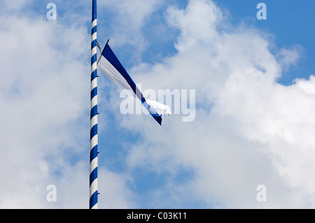 Bavarian flag flying on a Maypole, Bavaria, Germany, Europe Stock Photo