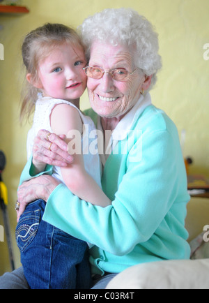 Happy girl and her grandma playing outdoors Stock Photo - Alamy