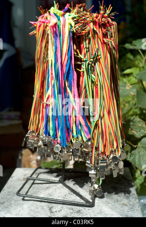 Carnival whistles sold on a rack by the roadside, Notting Hill Carnival, London 2010 Stock Photo