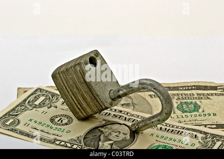 American one dollar bills in an open padlock Stock Photo