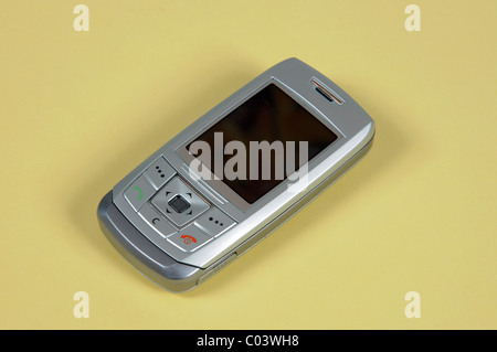 Silver mobile phone, Spain, Western Europe. Stock Photo