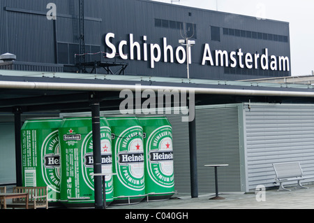 Schiphol Airport, Amsterdam with oversized beer tins advertising Heineken Stock Photo