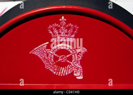 Close up view of a royal crown symbol with hunting horn on a post or mail box in Copenhagen, Denmark. Stock Photo