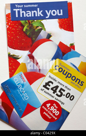 Tesco clubcard with leaflets on white background Stock Photo