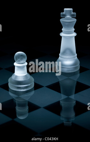 Macro shot of glass chess pieces against a black background Stock Photo