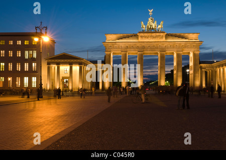 The floodlit Brandenburg gate in Berlin at dusk Stock Photo