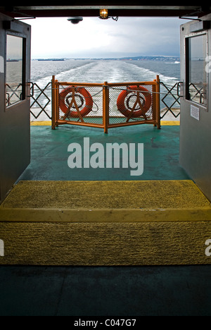 View looking back from aft deck of Ferry leaving Staten Island, New York, USA Stock Photo