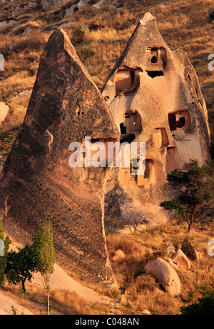 Two conical rocks used as rock cut 'cavehouses' and dovecotes in the 'backside' of Uchisar town, Nevsehir, Cappadocia Stock Photo