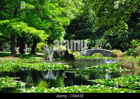 Lilly pond and stone bridge at Queenstown Gardens, Queenstown, Otago Region, South Island, New Zealand Stock Photo