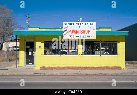 The bright yellow building of Sierra Trading Company pawn shop in Carrizozo, New Mexico. Stock Photo