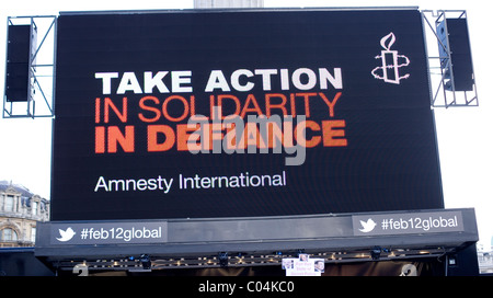 Massive display screen. Take Action on Solidarity in Defiance at a rally for Amnesty International supporters Egyptian activists