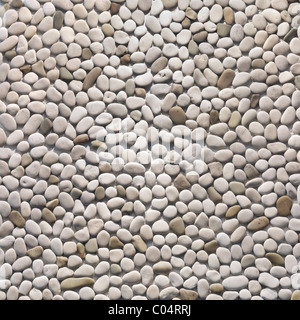 Ivory pebbles texture background. Pebblestone interior and exterior stone finish Stock Photo