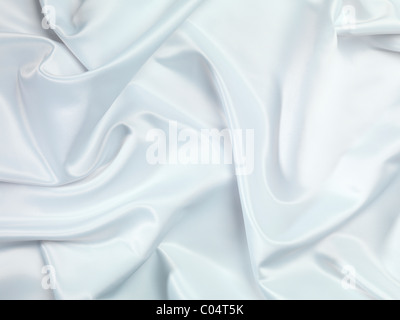 Shiny White silky fabric folds background texture Stock Photo